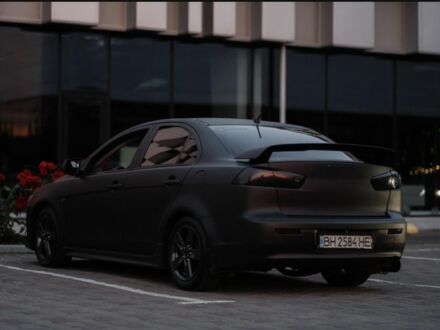 Чорний Міцубісі Lancer, об'ємом двигуна 2 л та пробігом 210 тис. км за 6698 $, фото 1 на Automoto.ua