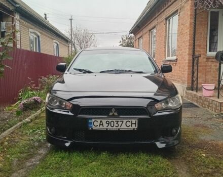 Чорний Міцубісі Lancer, об'ємом двигуна 2 л та пробігом 273 тис. км за 7100 $, фото 1 на Automoto.ua