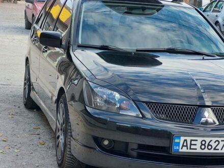 Чорний Міцубісі Lancer, об'ємом двигуна 2 л та пробігом 294 тис. км за 4800 $, фото 1 на Automoto.ua