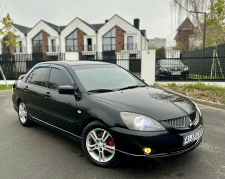 Черный Мицубиси Лансер, объемом двигателя 2 л и пробегом 260 тыс. км за 5300 $, фото 1 на Automoto.ua