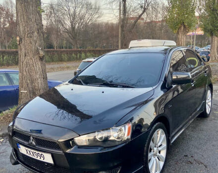 Черный Мицубиси Лансер, объемом двигателя 2 л и пробегом 222 тыс. км за 7500 $, фото 1 на Automoto.ua