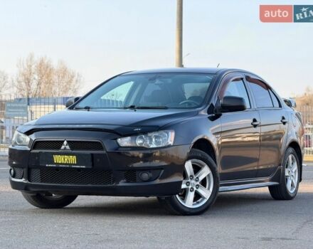 Черный Мицубиси Лансер, объемом двигателя 2 л и пробегом 228 тыс. км за 6950 $, фото 1 на Automoto.ua