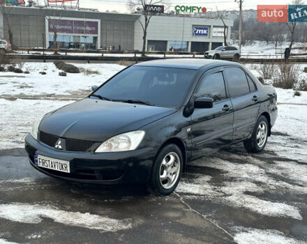 Черный Мицубиси Лансер, объемом двигателя 1.6 л и пробегом 184 тыс. км за 4300 $, фото 1 на Automoto.ua