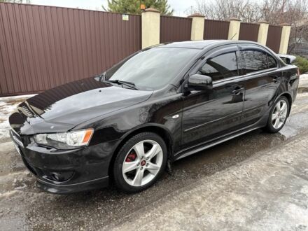 Черный Мицубиси Лансер, объемом двигателя 2 л и пробегом 188 тыс. км за 6300 $, фото 1 на Automoto.ua