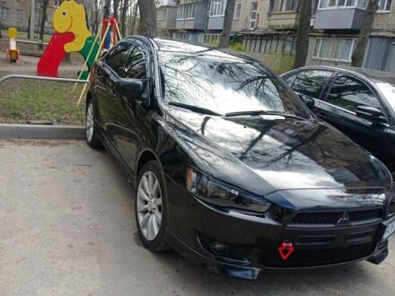 Черный Мицубиси Лансер, объемом двигателя 2 л и пробегом 245 тыс. км за 7500 $, фото 1 на Automoto.ua
