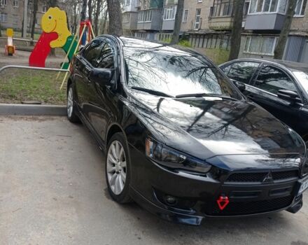 Черный Мицубиси Лансер, объемом двигателя 2 л и пробегом 245 тыс. км за 7500 $, фото 1 на Automoto.ua