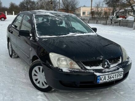 Чорний Міцубісі Lancer, об'ємом двигуна 1.6 л та пробігом 206 тис. км за 3700 $, фото 1 на Automoto.ua