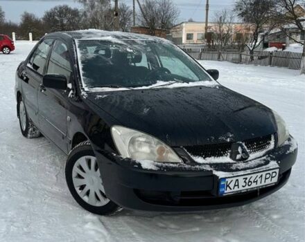 Чорний Міцубісі Lancer, об'ємом двигуна 1.6 л та пробігом 206 тис. км за 3700 $, фото 1 на Automoto.ua