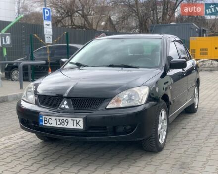 Черный Мицубиси Лансер, объемом двигателя 1.6 л и пробегом 240 тыс. км за 3800 $, фото 1 на Automoto.ua