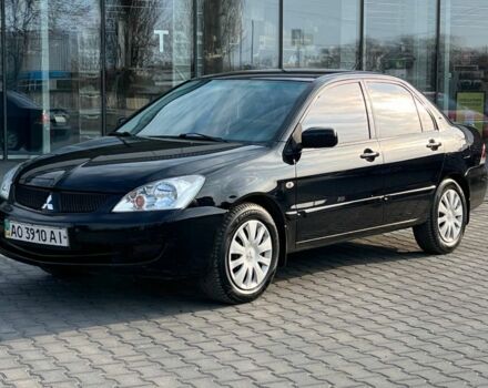 Черный Мицубиси Лансер, объемом двигателя 1.6 л и пробегом 186 тыс. км за 3900 $, фото 1 на Automoto.ua