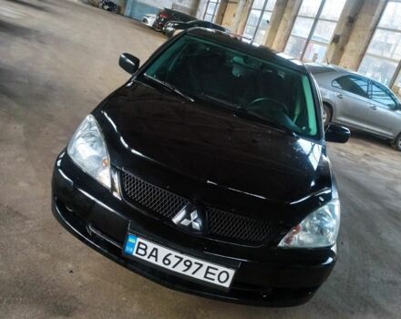 Черный Мицубиси Лансер, объемом двигателя 1.6 л и пробегом 251 тыс. км за 4500 $, фото 1 на Automoto.ua