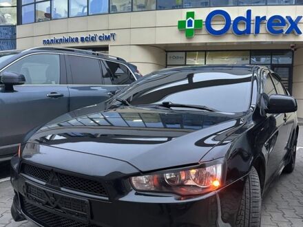 Черный Мицубиси Лансер, объемом двигателя 2 л и пробегом 245 тыс. км за 6950 $, фото 1 на Automoto.ua