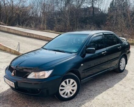 Черный Мицубиси Лансер, объемом двигателя 1.6 л и пробегом 280 тыс. км за 4500 $, фото 1 на Automoto.ua