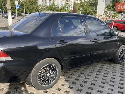 Міцубісі Lancer 2007 у Києві на Automoto.ua Чорний Міцубісі Lancer, об'ємом двигуна 1.6 л та пробігом 150 тис. км за 4800 $, фото 1 на Automoto.ua