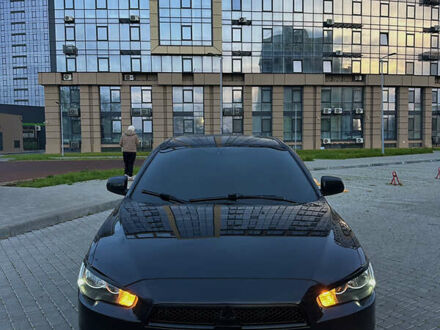 Черный Мицубиси Лансер, объемом двигателя 2 л и пробегом 245 тыс. км за 6200 $, фото 1 на Automoto.ua