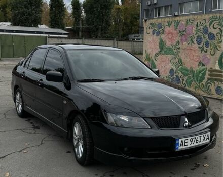 Чорний Міцубісі Lancer, об'ємом двигуна 2 л та пробігом 143 тис. км за 5400 $, фото 1 на Automoto.ua