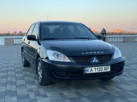 Черный Мицубиси Лансер, объемом двигателя 1.6 л и пробегом 237 тыс. км за 4300 $, фото 1 на Automoto.ua