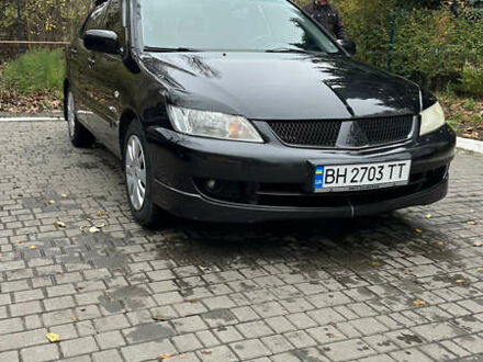 Чорний Міцубісі Lancer, об'ємом двигуна 1.59 л та пробігом 300 тис. км за 3400 $, фото 1 на Automoto.ua
