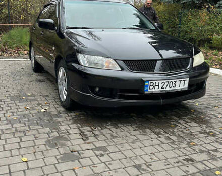 Чорний Міцубісі Lancer, об'ємом двигуна 1.59 л та пробігом 300 тис. км за 3400 $, фото 1 на Automoto.ua