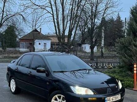 Черный Мицубиси Лансер, объемом двигателя 1.6 л и пробегом 249 тыс. км за 5000 $, фото 1 на Automoto.ua