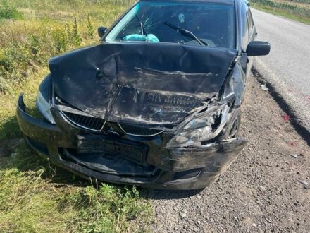 Черный Мицубиси Лансер, объемом двигателя 1.6 л и пробегом 229 тыс. км за 2500 $, фото 1 на Automoto.ua