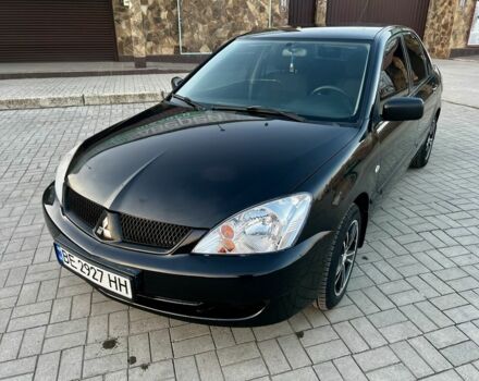 Черный Мицубиси Лансер, объемом двигателя 1.6 л и пробегом 291 тыс. км за 3399 $, фото 1 на Automoto.ua