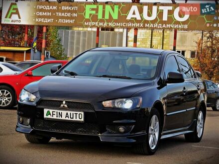 Черный Мицубиси Лансер, объемом двигателя 2 л и пробегом 178 тыс. км за 7400 $, фото 1 на Automoto.ua