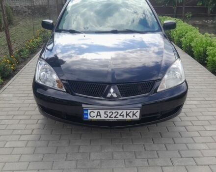 Черный Мицубиси Лансер, объемом двигателя 1.6 л и пробегом 200 тыс. км за 3500 $, фото 1 на Automoto.ua