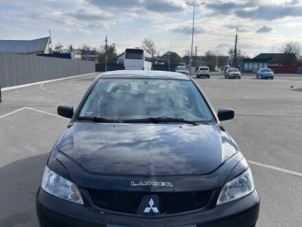 Черный Мицубиси Лансер, объемом двигателя 1.6 л и пробегом 310 тыс. км за 3500 $, фото 1 на Automoto.ua