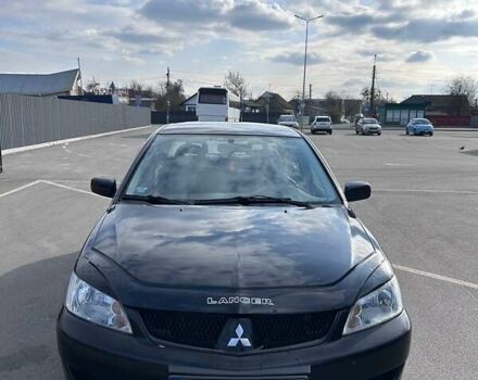 Черный Мицубиси Лансер, объемом двигателя 1.6 л и пробегом 310 тыс. км за 3500 $, фото 1 на Automoto.ua