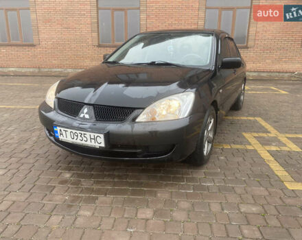 Чорний Міцубісі Lancer, об'ємом двигуна 1.58 л та пробігом 211 тис. км за 6333 $, фото 1 на Automoto.ua
