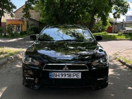 Черный Мицубиси Лансер, объемом двигателя 2 л и пробегом 140 тыс. км за 7500 $, фото 1 на Automoto.ua