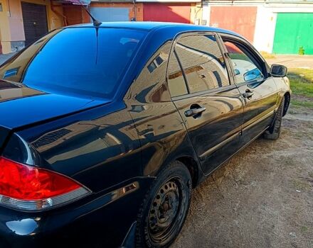 Чорний Міцубісі Lancer, об'ємом двигуна 1.6 л та пробігом 230 тис. км за 4700 $, фото 1 на Automoto.ua