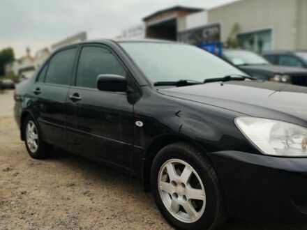 Чорний Міцубісі Lancer, об'ємом двигуна 1.6 л та пробігом 257 тис. км за 4200 $, фото 1 на Automoto.ua