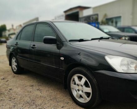 Чорний Міцубісі Lancer, об'ємом двигуна 1.6 л та пробігом 257 тис. км за 4200 $, фото 1 на Automoto.ua