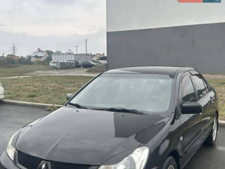 Чорний Міцубісі Lancer, об'ємом двигуна 1.58 л та пробігом 240 тис. км за 4000 $, фото 1 на Automoto.ua
