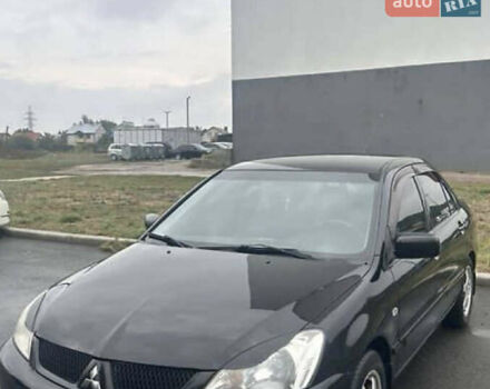 Черный Мицубиси Лансер, объемом двигателя 1.58 л и пробегом 240 тыс. км за 4000 $, фото 1 на Automoto.ua