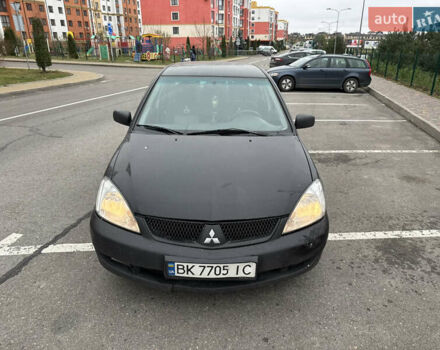 Чорний Міцубісі Lancer, об'ємом двигуна 1.58 л та пробігом 388 тис. км за 2300 $, фото 1 на Automoto.ua