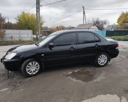 Мицубиси Лансер 2008 в Днепре (Днепропетровске) на Automoto.ua Черный Мицубиси Лансер, объемом двигателя 1.6 л и пробегом 270 тыс. км за 3800 $, фото 1 на Automoto.ua