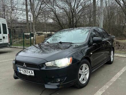 Черный Мицубиси Лансер, объемом двигателя 2 л и пробегом 185 тыс. км за 6100 $, фото 1 на Automoto.ua