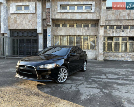 Черный Мицубиси Лансер, объемом двигателя 2 л и пробегом 236 тыс. км за 6450 $, фото 1 на Automoto.ua