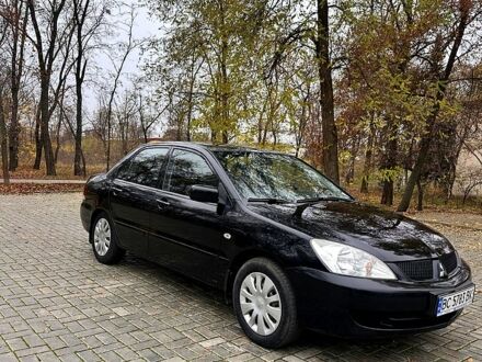 Черный Мицубиси Лансер, объемом двигателя 1.6 л и пробегом 185 тыс. км за 5500 $, фото 1 на Automoto.ua