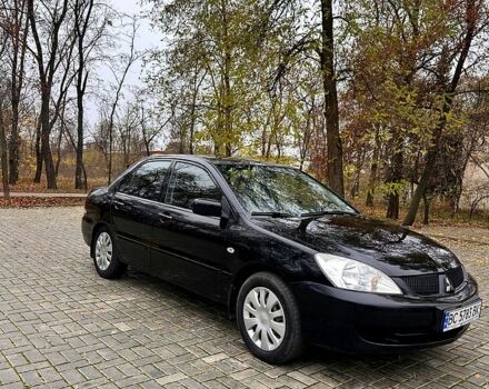 Черный Мицубиси Лансер, объемом двигателя 1.6 л и пробегом 185 тыс. км за 5500 $, фото 1 на Automoto.ua