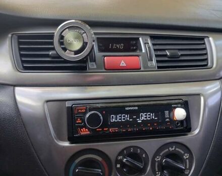 Чорний Міцубісі Lancer, об'ємом двигуна 1.58 л та пробігом 323 тис. км за 4500 $, фото 1 на Automoto.ua