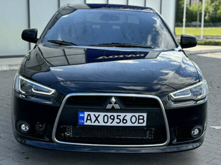 Чорний Міцубісі Lancer, об'ємом двигуна 2 л та пробігом 130 тис. км за 7700 $, фото 1 на Automoto.ua