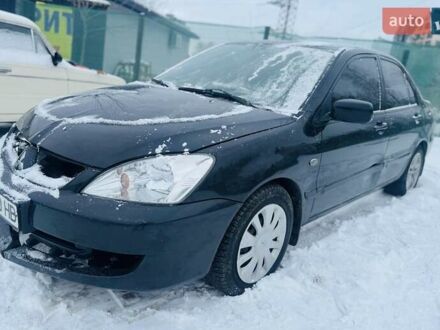 Черный Мицубиси Лансер, объемом двигателя 1.6 л и пробегом 179 тыс. км за 2700 $, фото 1 на Automoto.ua