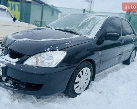 Черный Мицубиси Лансер, объемом двигателя 1.6 л и пробегом 179 тыс. км за 2700 $, фото 1 на Automoto.ua