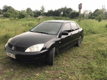 Чорний Міцубісі Lancer, об'ємом двигуна 1.6 л та пробігом 58 тис. км за 5000 $, фото 1 на Automoto.ua