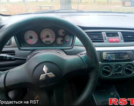 Чорний Міцубісі Lancer, об'ємом двигуна 1.6 л та пробігом 190 тис. км за 4500 $, фото 1 на Automoto.ua