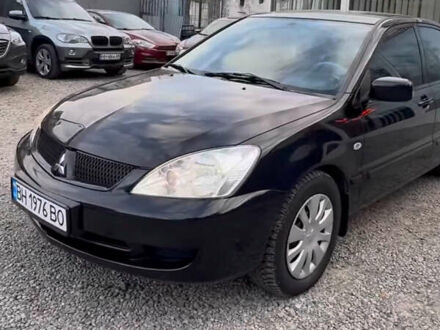 Черный Мицубиси Лансер, объемом двигателя 1.58 л и пробегом 469 тыс. км за 4600 $, фото 1 на Automoto.ua